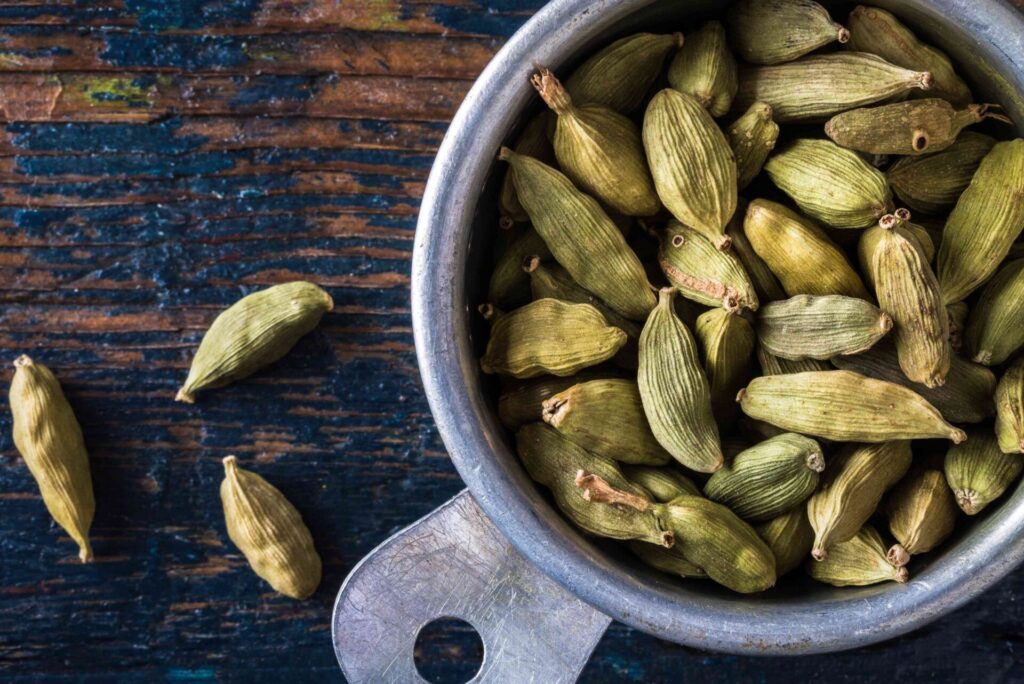 close up of cardamom in container on table 692783765 de109316d6c44a37b5d6dace1b93c17c