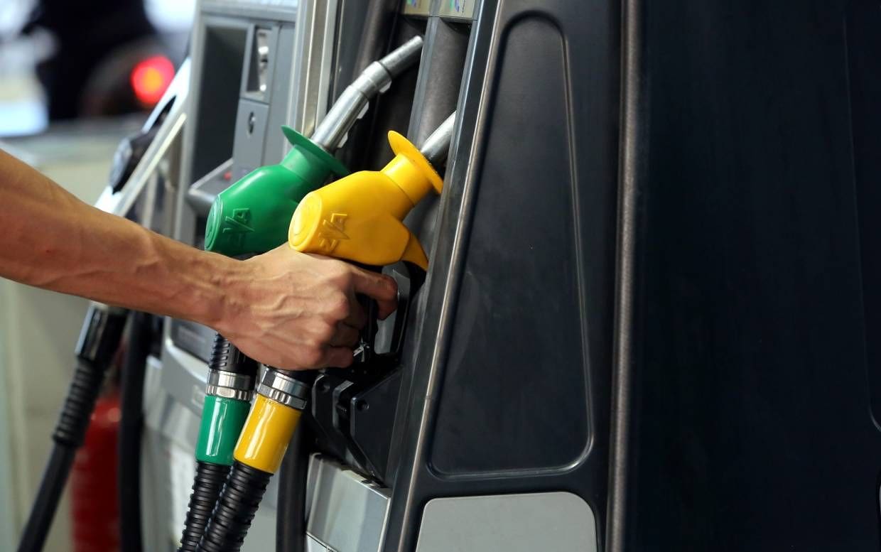 People fill the petrol into his car in a petrol station in Kuala Lumpur.AZHAR MAHFOF/The Star